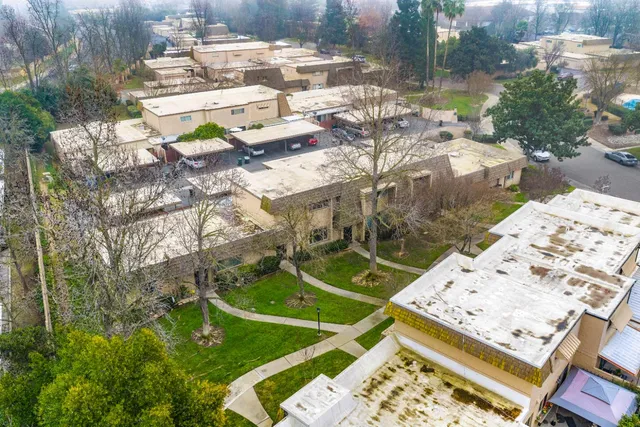 a view of a pool with porch and a yard