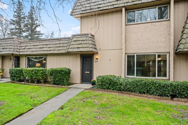 a front view of a house with a yard
