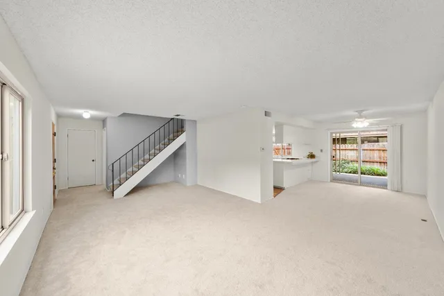 a view of a livingroom with furniture and a flat screen tv