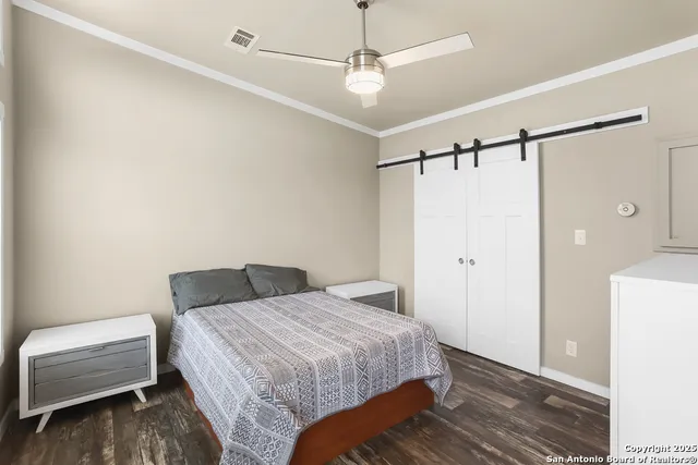 a bedroom with a bed and a chair