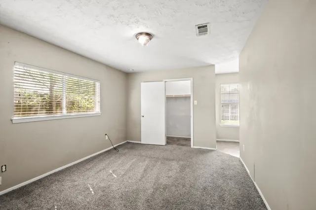 an empty room with windows