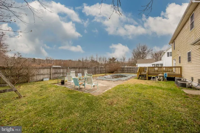 a view of a lake with building and car parked