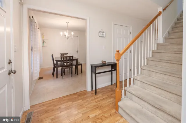 a view of a livingroom with furniture and stairs