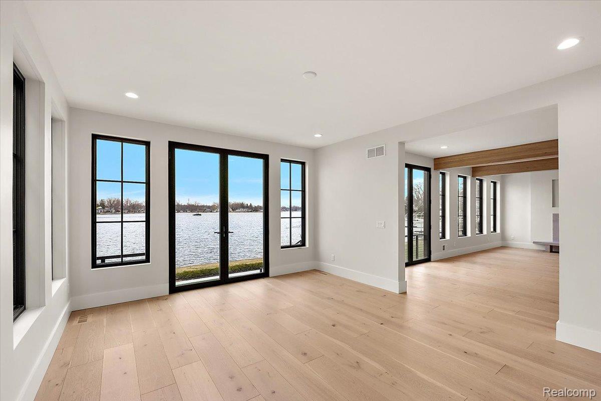 13459 Haddon Street Fenton, MI 48430 - Photo 17 of 84 Unfurnished room with a water view, light wood finished floors, and recessed lighting