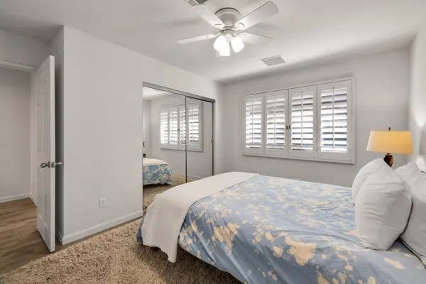 a bedroom with a bed and a window