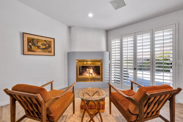 a living room with blue walls and a large window