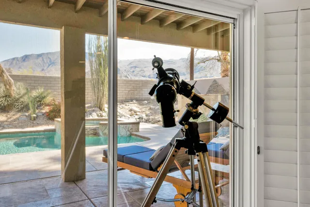 a room that has a glass door and a glass door