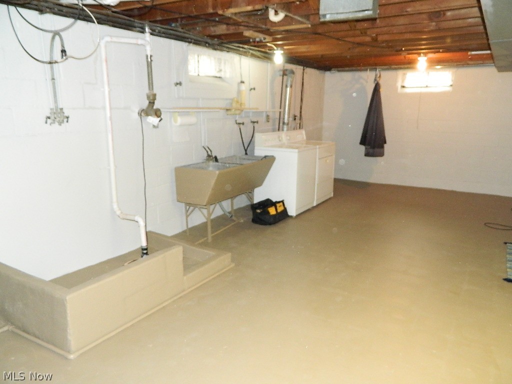 34505 Pettibone Road Solon, OH 44139 - Photo 24 of 32 Utility and Laundry Section of the Basement. Home has Interior Waterproofing from a Past Owner - Current Owners Do Not Have Any Paperwork Regarding Work Done.