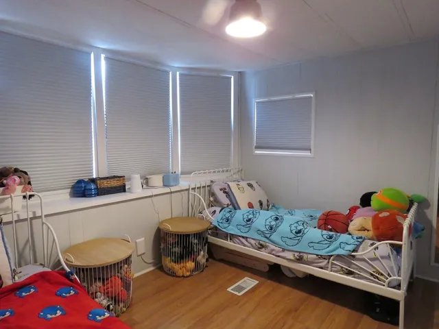 a bedroom with a bed and a couch