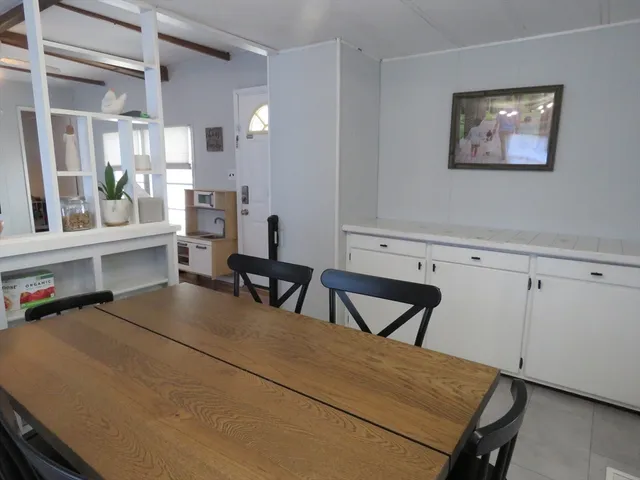 a view of dining room with furniture and window