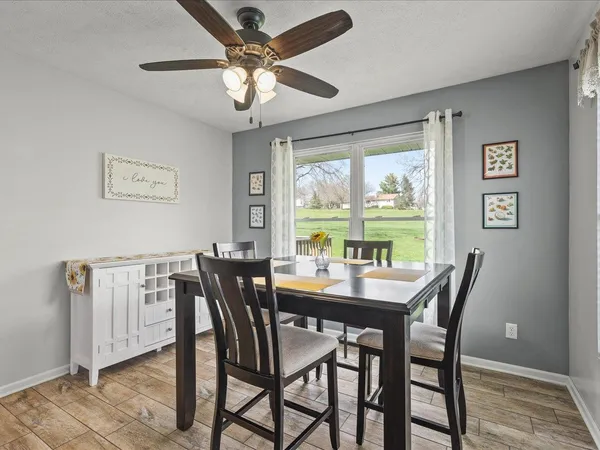 a view of a dining room with furniture window and outside view