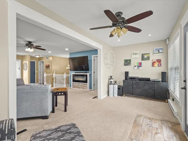 a living room with furniture and kitchen view