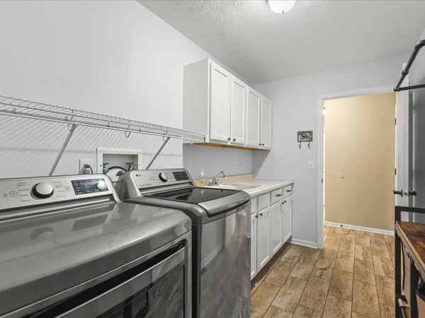 a kitchen that has a sink and a stove