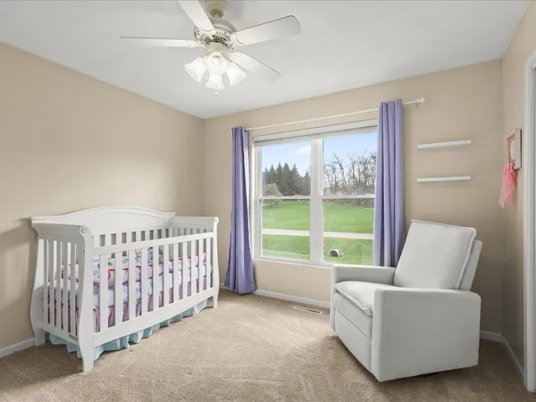 a bedroom with furniture and windows