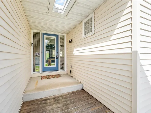 a view of a porch with wooden floor