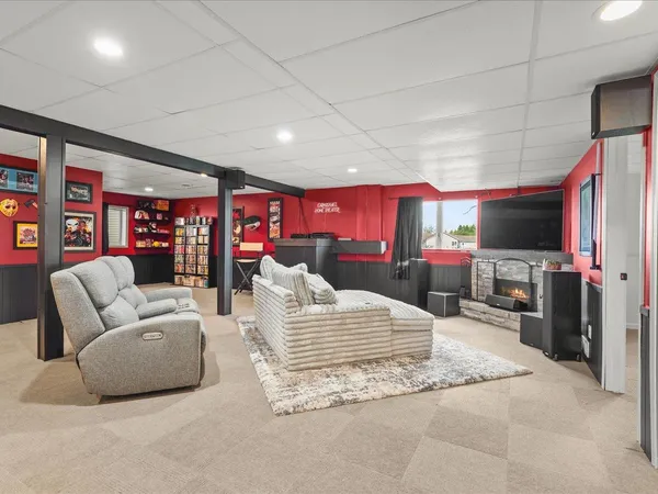 a bedroom with furniture and a flat screen tv