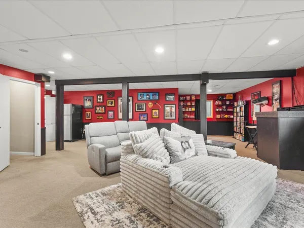 a bed room with furniture and a large window