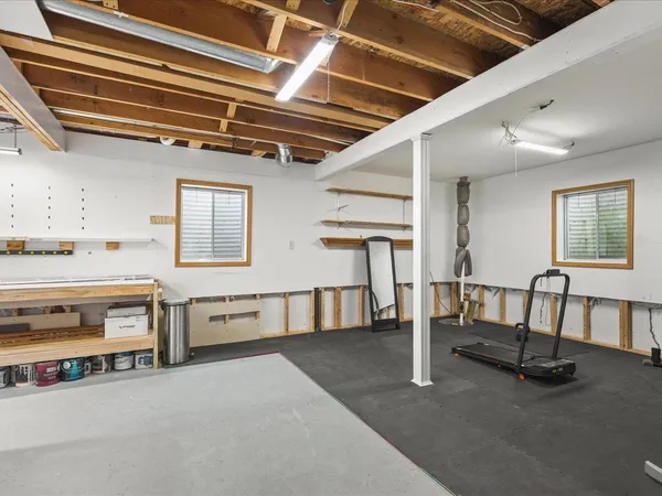 a view of an empty room with windows