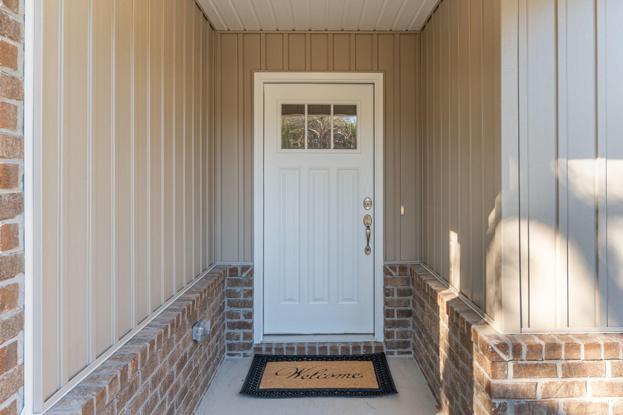 1206 Sunshine Drive Crestview, FL 32539 - Photo 1 of 28 a view of a entryway door with wooden floor