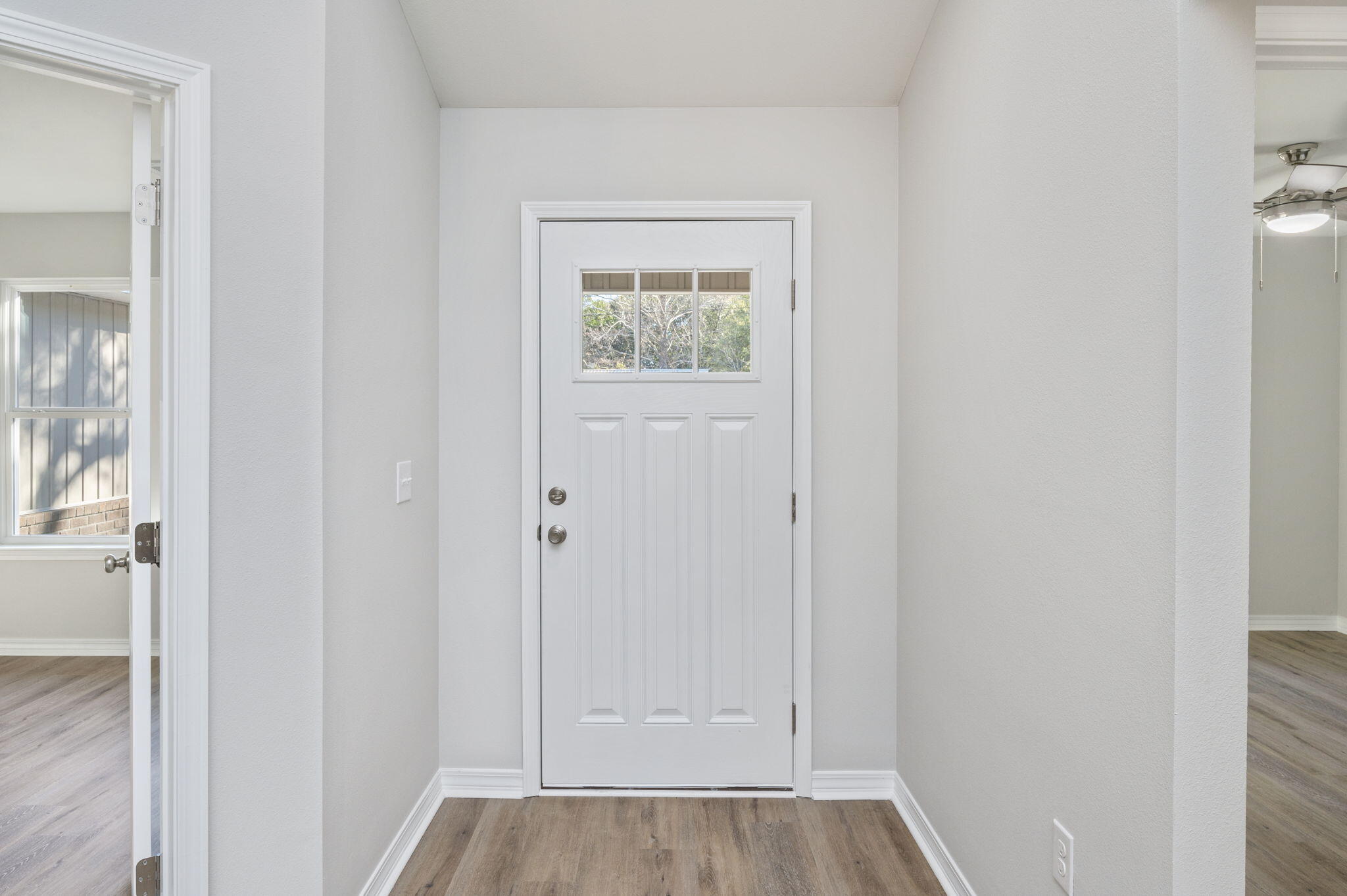 1206 Sunshine Drive Crestview, FL 32539 - Photo 26 of 28 a view of an entryway with wooden floor