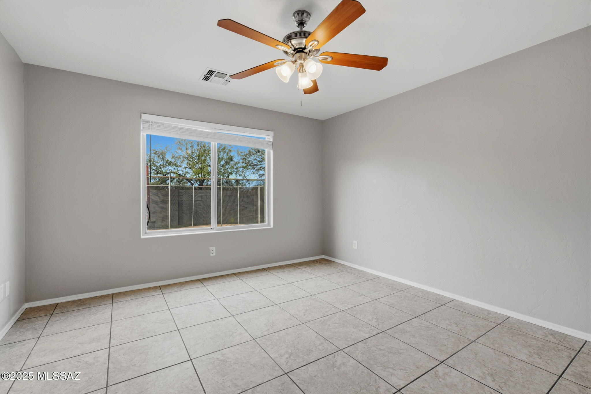 8244 South Lost Mountain Road Tucson, AZ 85747 - Photo 14 of 41 a view of an empty room with a window