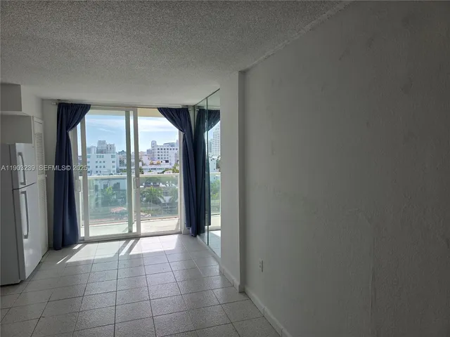 a view of a room with sliding glass door
