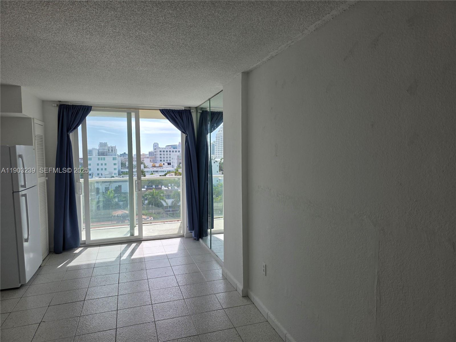 1750 James Avenue, Unit 9C Miami Beach, FL 33139 - Photo 11 of 28 a view of a room with sliding glass door