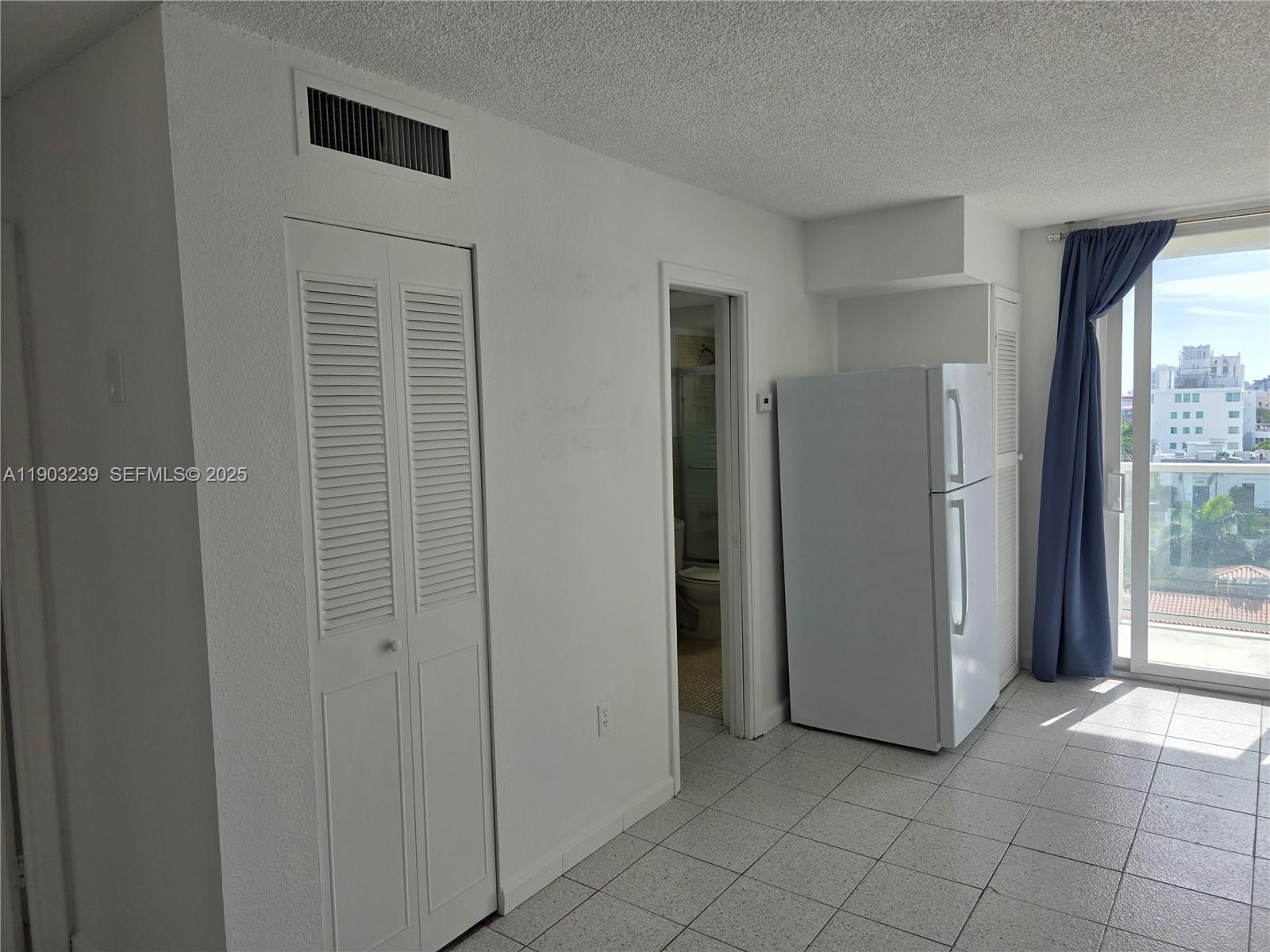 1750 James Avenue, Unit 9C Miami Beach, FL 33139 - Photo 13 of 28 a view of a hallway with closet and utility room