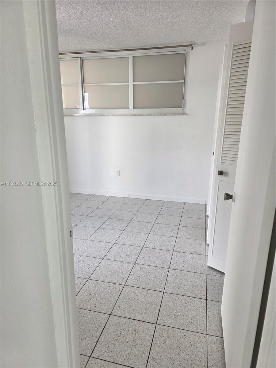 1750 James Avenue, Unit 9C Miami Beach, FL 33139 - Photo 16 of 28 a view of an empty walk in closet