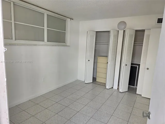 an empty room with closet