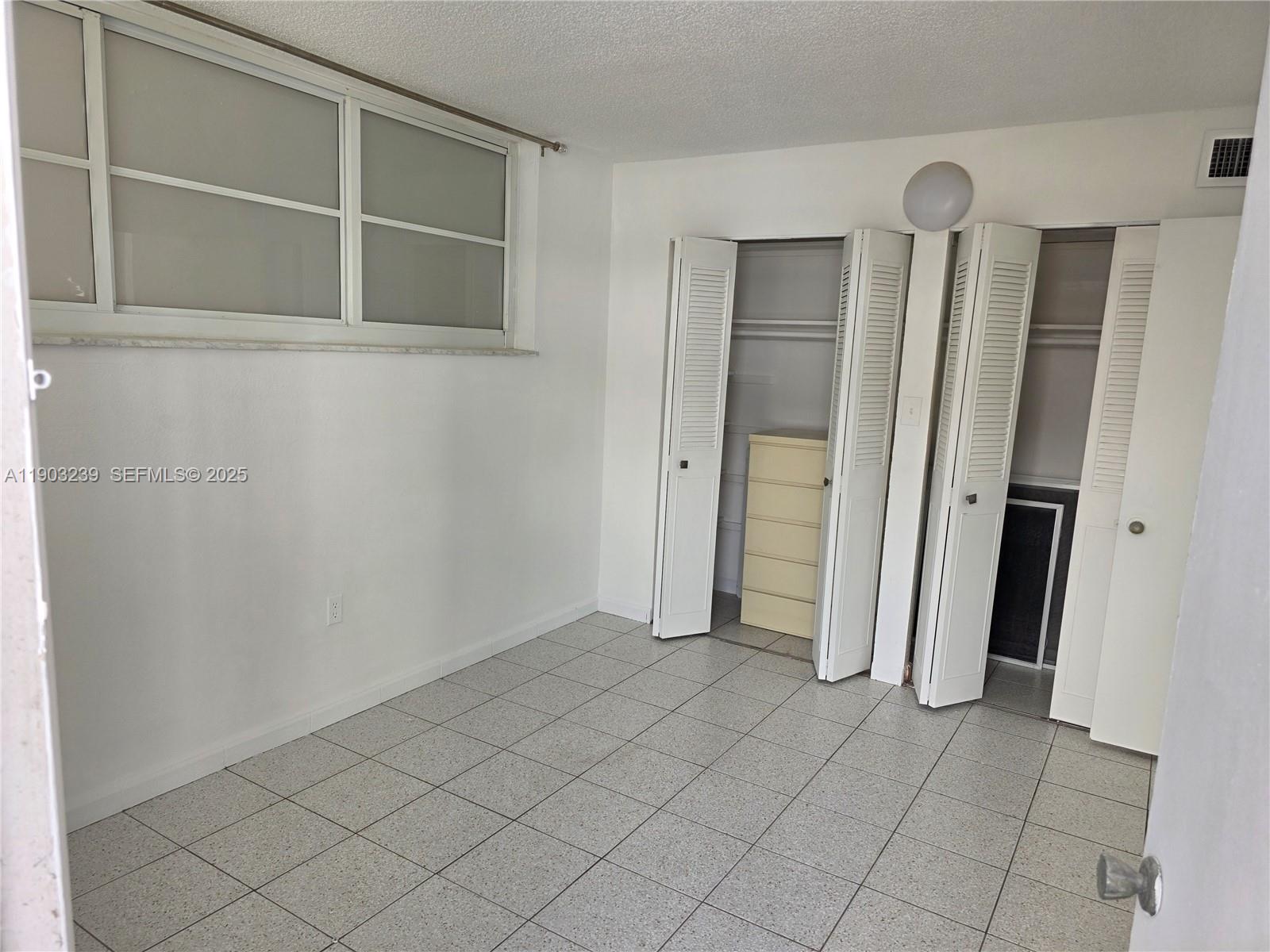 1750 James Avenue, Unit 9C Miami Beach, FL 33139 - Photo 20 of 28 an empty room with closet