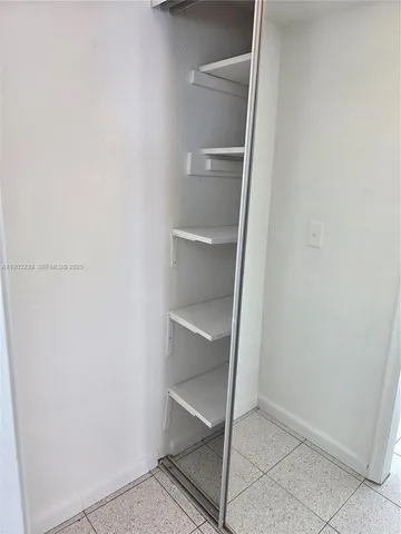 a view of an empty walk in closet