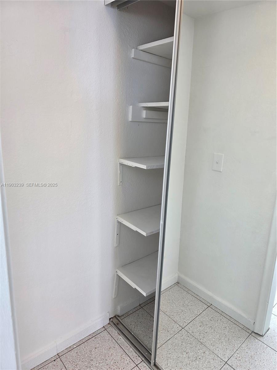 1750 James Avenue, Unit 9C Miami Beach, FL 33139 - Photo 22 of 28 a view of an empty walk in closet