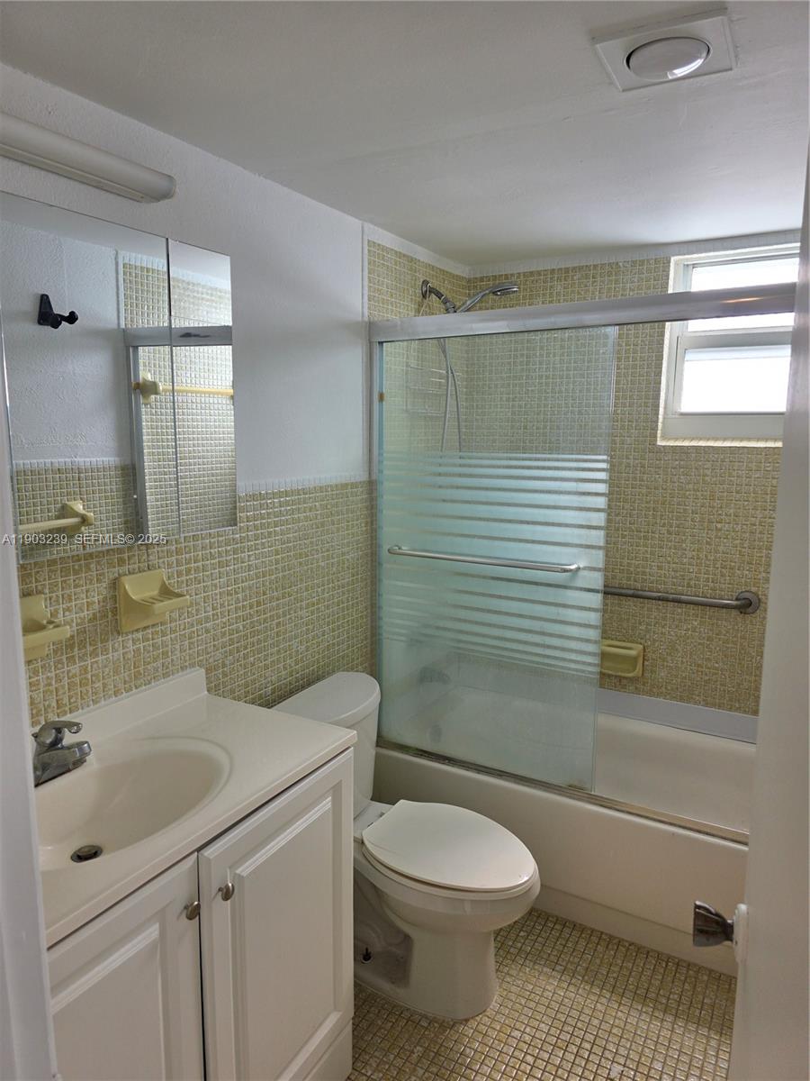1750 James Avenue, Unit 9C Miami Beach, FL 33139 - Photo 25 of 28 a bathroom with a sink a toilet and shower