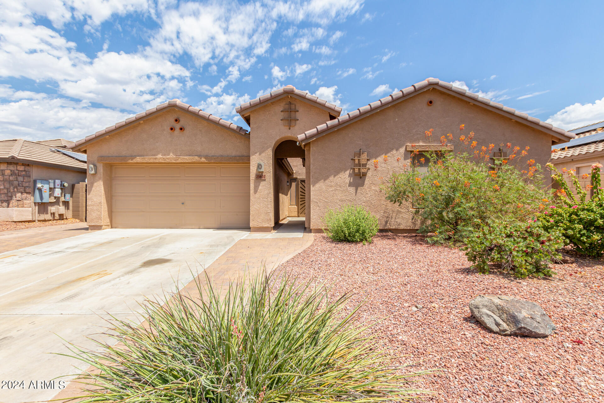 25602 West Ripple Road Buckeye, AZ 85326 - Photo 1 of 38 a front view of a house with a yard and garage