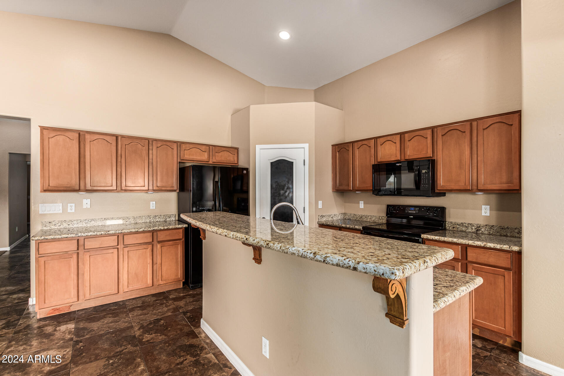 25602 West Ripple Road Buckeye, AZ 85326 - Photo 13 of 38 a kitchen with stainless steel appliances granite countertop a sink stove and microwave