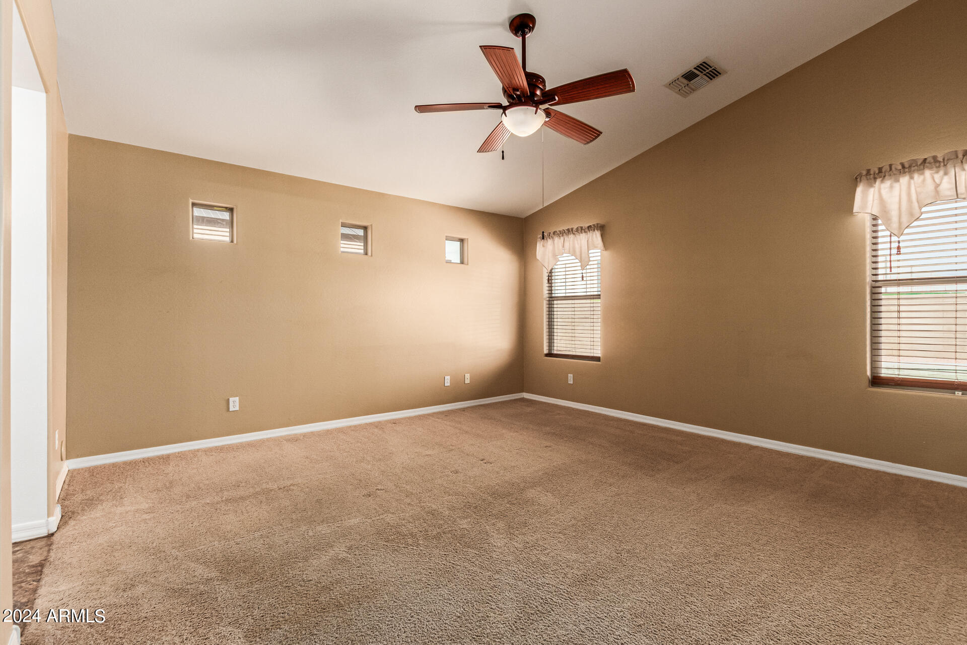 25602 West Ripple Road Buckeye, AZ 85326 - Photo 15 of 38 a view of an empty room with a window
