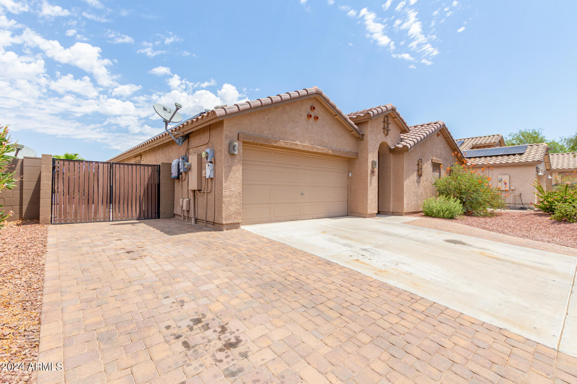 25602 West Ripple Road Buckeye, AZ 85326 - Photo 2 of 38 a view of a house with a yard and garage