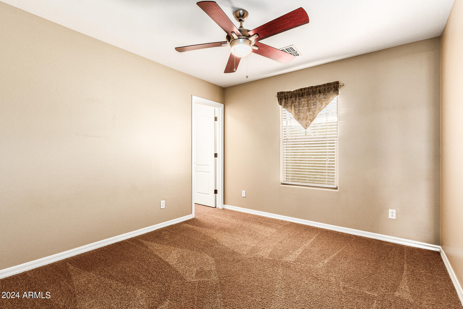 25602 West Ripple Road Buckeye, AZ 85326 - Photo 25 of 38 an empty room with windows and fan