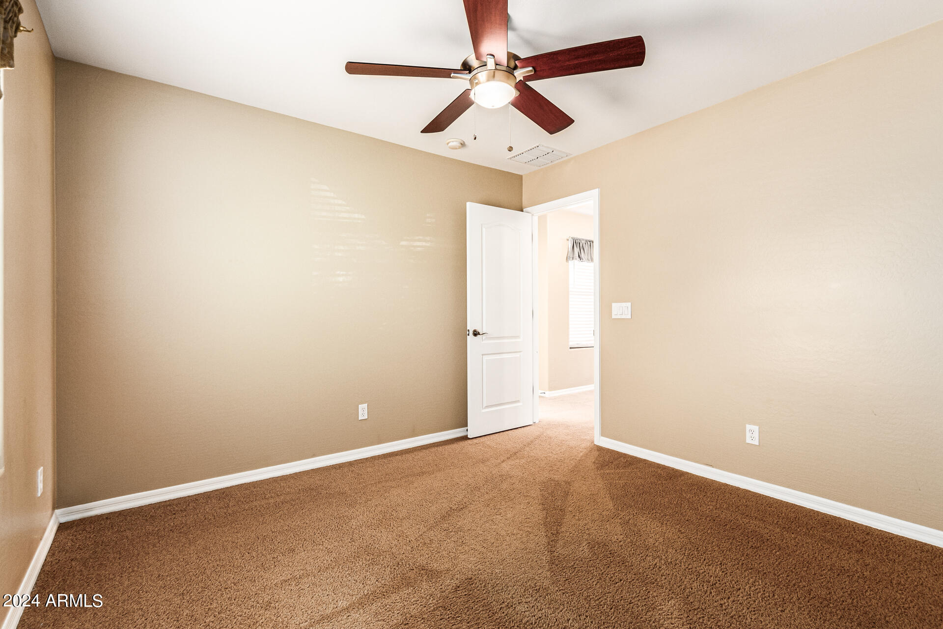 25602 West Ripple Road Buckeye, AZ 85326 - Photo 26 of 38 an empty room with ceiling fan and window