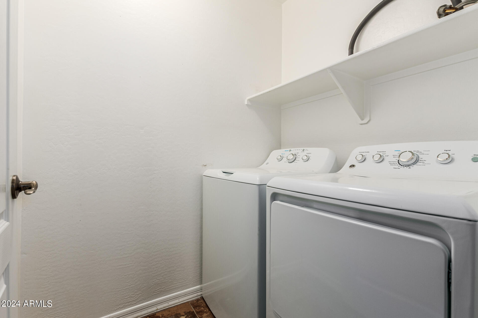 25602 West Ripple Road Buckeye, AZ 85326 - Photo 31 of 38 a utility room with dryer and washer