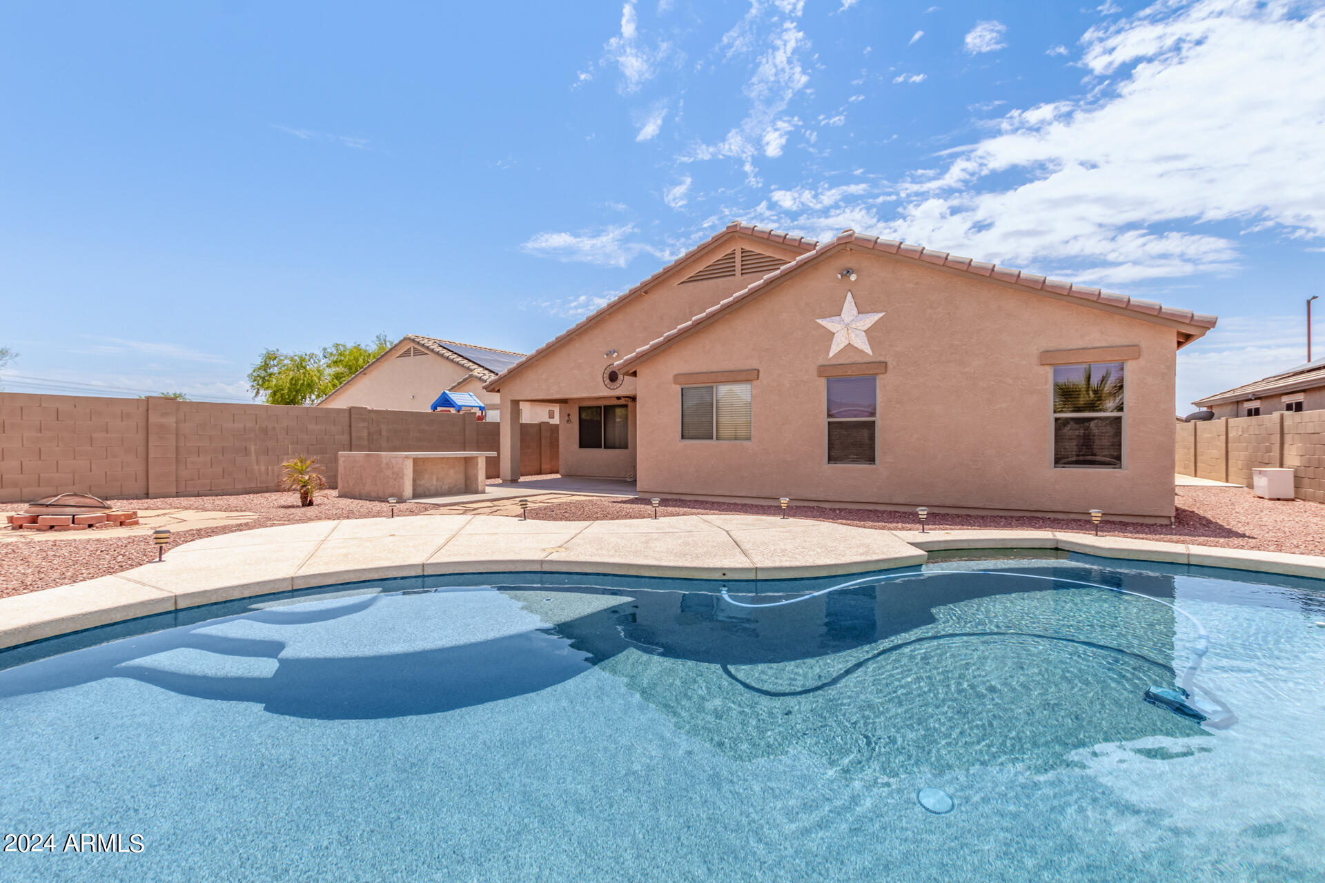 25602 West Ripple Road Buckeye, AZ 85326 - Photo 36 of 38 a swimming pool with outdoor seating and yard