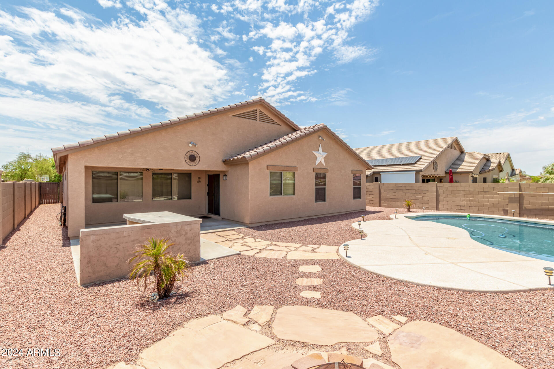 25602 West Ripple Road Buckeye, AZ 85326 - Photo 38 of 38 a front view of a house with a patio