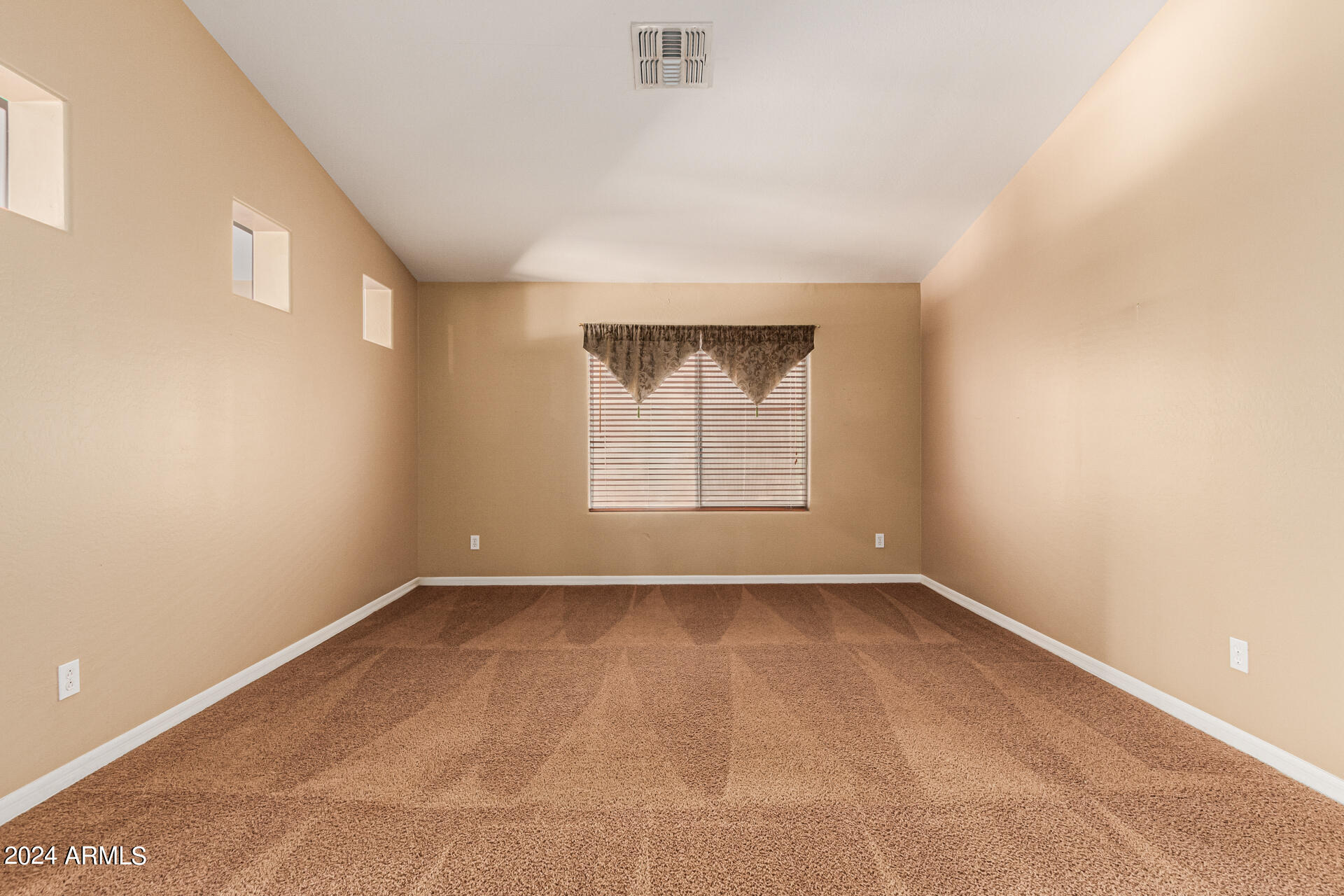 25602 West Ripple Road Buckeye, AZ 85326 - Photo 4 of 38 an empty room with a window