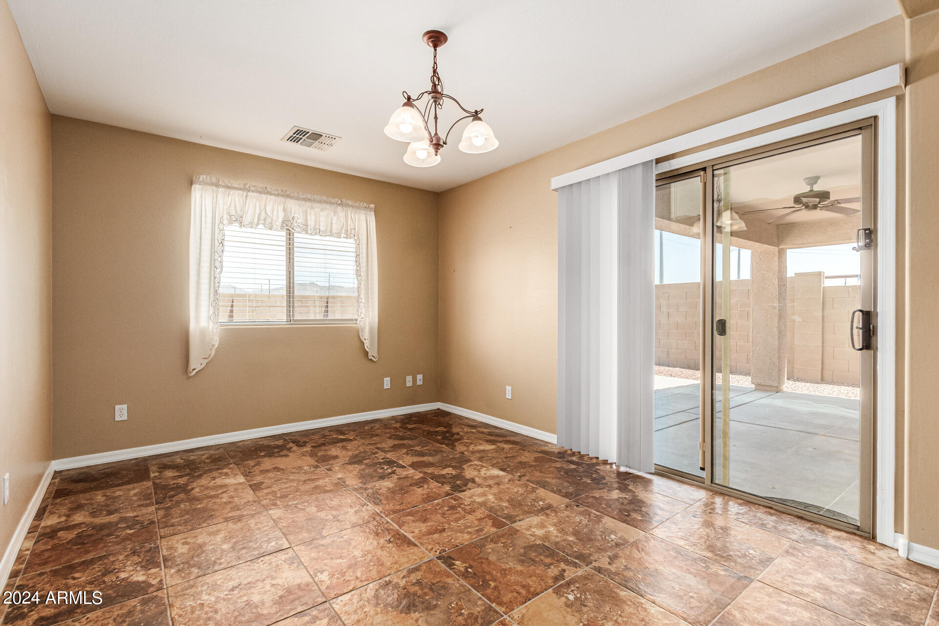 25602 West Ripple Road Buckeye, AZ 85326 - Photo 10 of 38 a view of an empty room with glass door