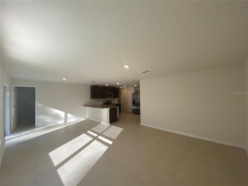 308 Hickory Course Radiel Ocala, FL 34472 - Photo 2 of 24 an empty room with projector and a table