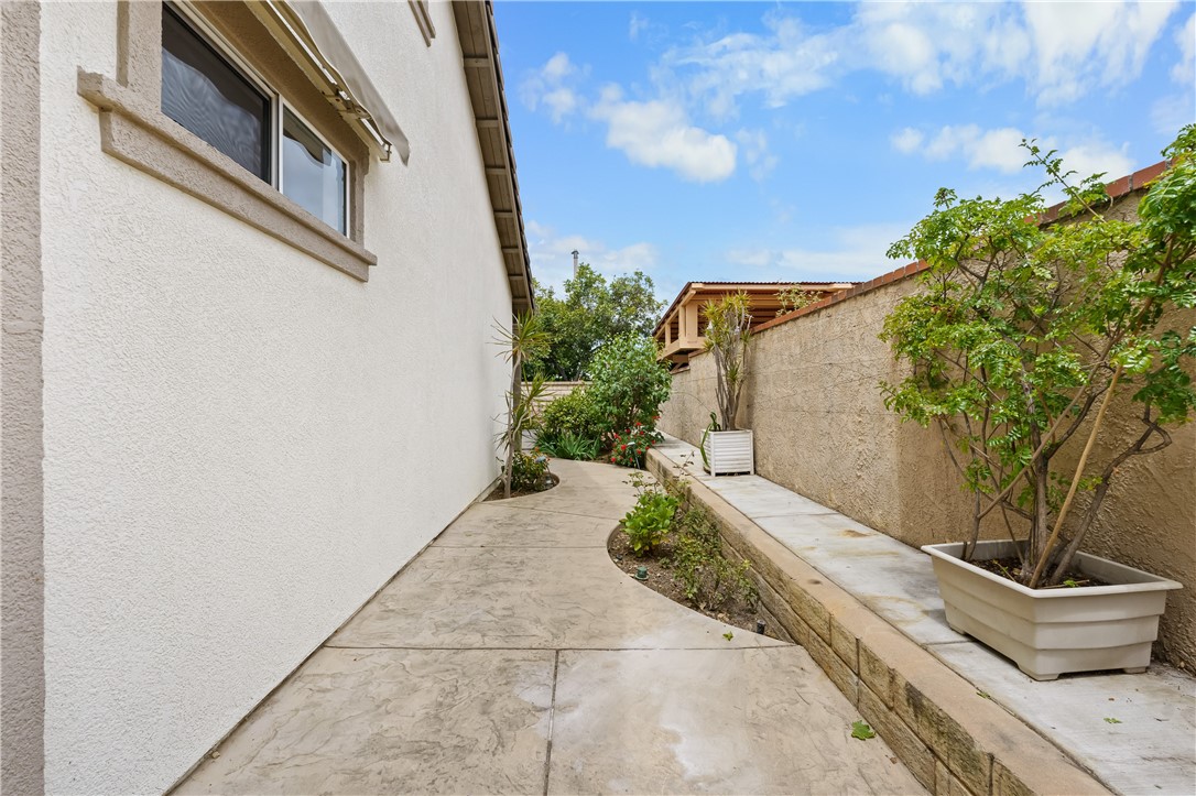 2095 Tulip Avenue Simi Valley, CA 93063 - Photo 17 of 39 a backyard of a house with potted plants