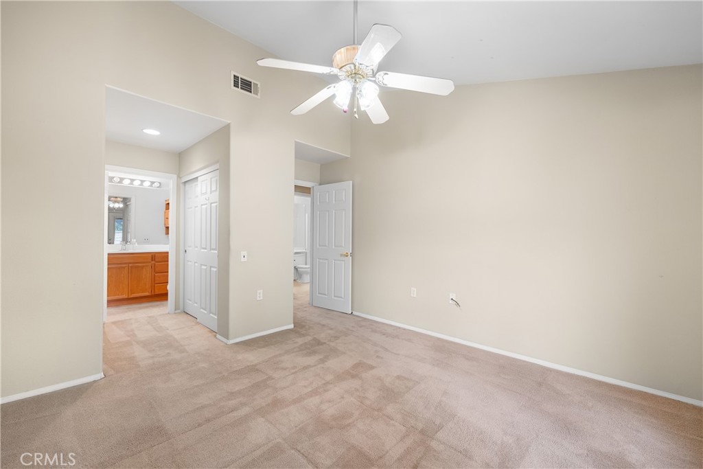 2095 Tulip Avenue Simi Valley, CA 93063 - Photo 18 of 39 an empty room with closet and a ceiling fan