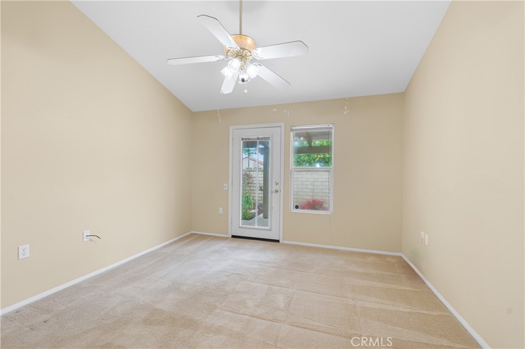2095 Tulip Avenue Simi Valley, CA 93063 - Photo 19 of 39 an empty room with chandelier fan and windows