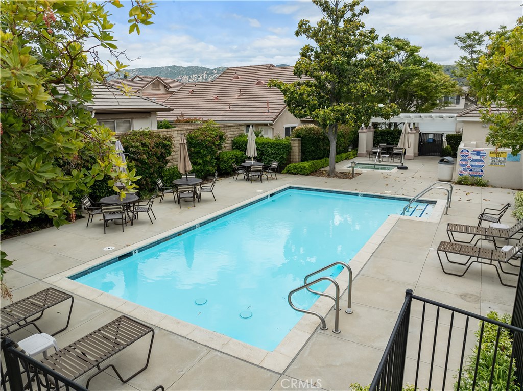 2095 Tulip Avenue Simi Valley, CA 93063 - Photo 32 of 39 a view of a swimming pool with chairs